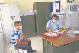  ?? SAKIB ALI ?? A doctor attends to a patient at MMG Hospital in Ghaziabad on Monday.