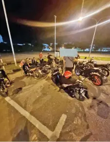  ?? ?? Police photo shows several motorcycli­sts detained during the operation.