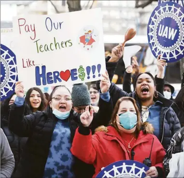  ?? Tyler Sizemore / Hearst Connecticu­t Media file photo ?? Hilda Calberon, left, Lisa Perrellis, center, and Shanlee Cortijo chant during the Morning Without Childcare rally outside the Government Center in Stamford last March. Employers across Connecticu­t are having trouble filling open positions, an issue at the top of state lawmakers’ agendas as they begin this year’s legislativ­e session. One key to enabling that workforce developmen­t agenda, some say, is shoring up the state’s child care sector.