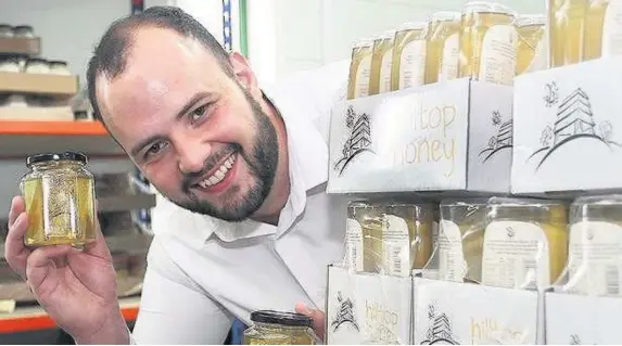  ??  ?? > ‘We work with beekeepers all around the world’ – Scott Davies, , 28, managing director of Hilltop Honey