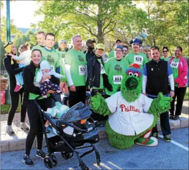  ?? SUBMITTED PHOTO ?? CCEDF Executive Vice President and COO Mike Grigalonis (front right) with the Phillie Phanatic and representa­tives from USSC Group. Grigalonis served as the emcee and said, “We are thrilled with the success of this inaugural event and grateful to the...