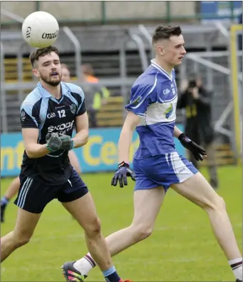  ??  ?? St John’s Conor Greene in action with Mark Devaney of St Farnan’s. Pics: Carl Brennan.