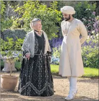  ?? AP PHOTO ?? In this image released by Focus Features, Judi Dench, left, and Ali Fazal appear in a scene from “Victoria and Abdul.”