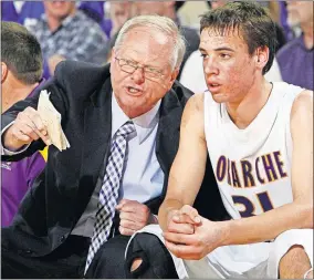  ?? [NATE BILLINGS/THE OKLAHOMAN] ?? Okarche coach Ray West, left, talks with John Schaefer during the 2012 Class A boys high school basketball tournament. West has the Warriors back in the state tournament this year, the first time since 2012.