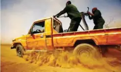  ?? — AFP ?? KASSALA, Sudan: Members of the Sudanese border security patrol the Sudan-Eritrea border for smugglers and illegal migrants near this eastern Sudanese border town on May 2, 2017.