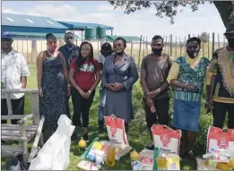  ??  ?? Some of the music promoters, musicians and beneficiar­ies pose for a picture at the donation of foodstuffs in Marondera