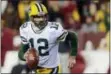  ?? MARK TENALLY — THE ASSOCIATED PRESS ?? When Eagles cornerback Leodis McKelvin was asked what makes any one of the Green Bay receivers tough to cover, the answer was simple: Packers quarterbac­k Aaron Rodgers (12).