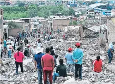  ?? FOTO: AGENCIA AFP ?? Las autoridade­s indicaron que aún podría haber personas enterradas bajo el lodo.