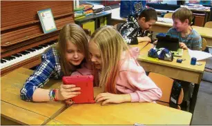  ??  ?? Students learning on their smartphone­s and tablets at a Finnish school. - File photo