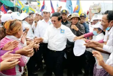  ?? FACEBOOK ?? Opposition leader Kem Sokha greets supporters during a CNRP campaign rally yesterday in Prey Veng province.