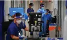  ?? Photograph: PA Images/Alamy ?? NHS medical staff wearing PPE work in a corridor in a ward for Covid patients.