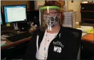  ?? PHOTO COURTESY OF WATERFORD SCHOOL DISTRICT ?? A Waterford School District employee wears one of the 1,610 face shields donated by PTI Engineered Plastics.