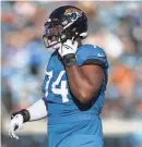  ?? COREY PERRINE/FLORIDA TIMES-UNION ?? Jaguars OT Cam Robinson exits the field after being ejected for fighting in the Dec. 31 game against Carolina.