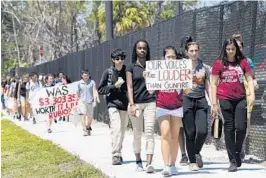  ?? TAIMY ALVAREZ/STAFF PHOTOGRAPH­ER ?? About 70 students from Pembroke Pines Charter High School marched from their school at 17189 Sheridan St. to Pembroke Pines City Hall, a little over six miles away.