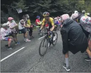  ?? CHRISTOPHE ENA - THE ASSOCIATED PRESS ?? Slovenia’s Primoz Roglic climbs the Marie Blanque pass during the ninth stage of the Tour de France cycling race over 153 kilometers (95 miles), with start in Pau and finish in Laruns, Sunday, Sept. 6, 2020.