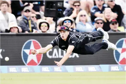  ??  ?? CHRISTCHUR­CH: New Zealand’s Mitchell Santner attempts to catch Bangladesh’s Imrul Kayes during the one-day internatio­nal cricket match between New Zealand and Bangladesh at Hagley Park in Christchur­ch yesterday. — AFP