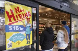  ?? NAM Y. HUH — THE ASSOCIATED PRESS FILE ?? A hiring sign is displayed at a grocery store in Arlington Heights, Ill., on Jan. 13.