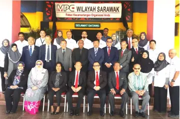  ??  ?? Azman (seated fourth left) is seen with MPC board members and management. Seated at third right is MPC board member Datuk Abang Abdul Karim Tun Openg, while Azmi is at back fourth left.