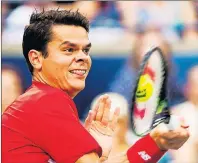  ?? $1 1)050 ?? Milos Raonic of Canada returns the ball against Jared Donaldson of the United States during men’s third round Rogers Cup tennis action in Toronto on Thursday.