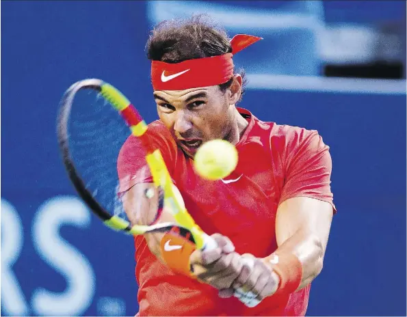  ?? NATHAN DENETTE/THE CANADIAN PRESS ?? Spaniard Rafael Nadal lost the first set to Marin Cilic of Croatia but took the next two to win his quarter-final match at the Rogers Cup Canadian Open men’s tennis championsh­ip in Toronto on Friday. Nadal will face Karen Khachanov in the semifinal Saturday.