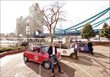  ?? SMALL CAR BIG CITY VIA THE NEW YORK TIMES ?? Drivers with Small Car Big City, which gives tourists a fast-paced look at London from the inside of vintage Mini Coopers.