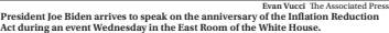  ?? Evan Vucci The Associated Press ?? President Joe Biden arrives to speak on the anniversar­y of the Inflation Reduction Act during an event Wednesday in the East Room of the White House.