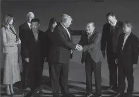  ?? OLIVIER DOULIERY/ABACA PRESS ?? U.S. President Donald Trump greets the three Americans freed from North Korea upon their arrival at Andrews Air Force Base outside Washington early Thursday morning in Maryland.