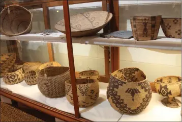  ?? PHOTOS BY ED BOOTH — ENTERPRISE-RECORD ?? Handmade baskets from area Native American tribes make up one of the main exhibits at the Colman Museum in Centervill­e on Sunday.