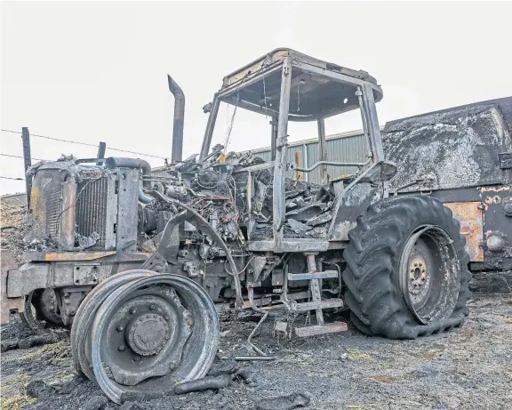  ?? Picture: Steven Brown. ?? A fire-damaged tractor and feeder after the blaze at Bankhead Farm near Windygates.