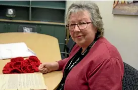  ?? STUFF ?? Invercargi­ll City Council archivist assistant Wendy McArthur with the World War I soldier boy letters between the Invercargi­ll City Corporatio­n and the shipping agent William Coward &amp; Co Ltd in London.