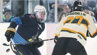  ??  ?? Reid Stieler, left, of Amherstbur­g, and Jake Vancoillie of Wallacebur­g battle for the puck.