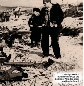  ??  ?? Carnage: French fishermen survey the bodies of Allied soldiers on Omaha beach