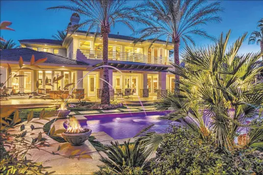  ?? COURTESY OF LUXURY ESTATES INTERNATIO­NAL ?? The $1.5 million Grand Legacy home features five fire pits in the resort-style backyard.