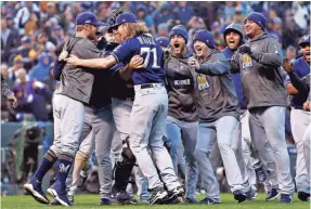  ?? RUSSELL LANSFORD/USA TODAY SPORTS ?? The Brewers celebrates the sweep of the Rockies on Sunday and advancemen­t to the NLCS for the first time since 2011.
