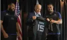  ?? Photograph: AFP/Getty Images ?? Biden receives a personalis­ed All Black rugby jersey from Jerome Kaino, right, and Charlie Faumuina during his visit to Auckland in 2016.