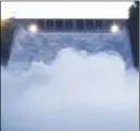  ?? AP PHoto ?? Water gushes from the Oroville Dam’s main spillway yesterday in Oroville, Calif.