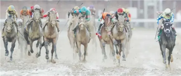  ??  ?? John Velazquez, right, rides Always Dreaming to victory in the 143rd running of the Kentucky Derby at Churchill Downs in Louisville on Saturday.