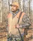  ?? STEVEN M.FALK/THE PHILADELPH­IA INQUIRER ?? Jonathan Wright, a hunter who owns his own hunting camp in the Poconos, stands in the State Game Lands behind his Pocono Summit cabin in Monroe County.