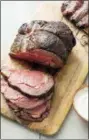  ?? DANIEL J. VAN ACKERE — AMERICA’S
TEST KITCHEN VIA AP ?? This undated photo provided by America’s Test Kitchen in June 2018shows a grill-roasted prime rib in Brookline, Mass. This recipe appears in the “The Cook’s Illustrate­d Meat Book.”