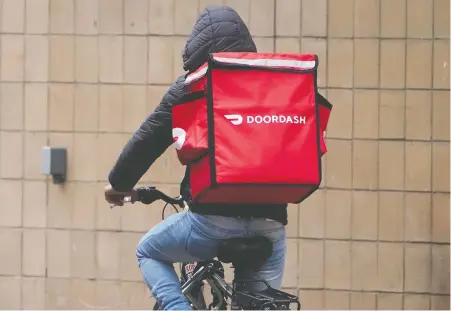  ?? CARLO ALLEGRI/ REUTERS FILES ?? DoorDash is going public in an IPO that could value the company at as much as US$32 billion. The San Francisco-based firm has seized on the pandemic-fuelled boom in demand for food delivery, as well as investor exuberance over new stock listings.