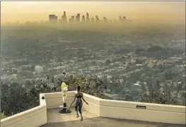  ?? Brian van der Brug Los Angeles Times ?? WILDFIRE smoke fills the L.A. Basin in 2020. Pollution from fires and agricultur­al dust had the strongest connection to dementia, the study found.