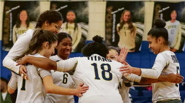  ?? MATTHEW J. LEE/GLOBE STAFF ?? The New Mission girls’ volleyball team celebrates a point in its preliminar­y-round victory over Brighton in the MIAA Division 5 tournament.