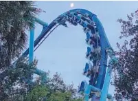  ??  ?? SeaWorld Orlando visitors zoom by at dusk aboard the Manta roller coaster. Some rides continue to be operated after dark during the theme park’s Electric Ocean Remix.