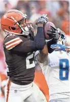  ?? SCOTT GALVIN / USA TODAY ?? Cleveland Browns cornerback Denzel Ward intercepts a pass to Detroit Lions wide receiver Josh Reynolds.