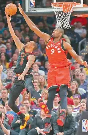  ?? — AFP ?? George Hill (left) of the Cleveland Cavaliers tries to get a second half shot off past Serge Ibaka of the Toronto Raptors during Game Three of the Eastern Conference semifinals during their NBA Playoffs at Quicken Loans Arena on Saturday in Cleveland,...