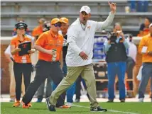  ?? STAFF PHOTO BY C.B. SCHMELTER ?? Tennessee coach Jeremy Pruitt signals for the teams to head to the locker room after Saturday’s spring game at Neyland Stadium.