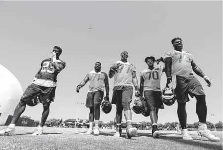  ?? Photos by Brett Coomer / Staff photograph­er ?? It’s practice time for the Texans’ Johnson Bademosi, from left, Tytus Howard, Martinas Rankin, Julie'n Davenport and Zach Fulton.