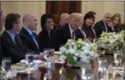  ?? SUSAN WALSH — THE ASSOCIATED PRESS ?? President Donald Trump, sitting next to U.S. Ambassador to the UN Nikki Haley, speaks during a working lunch with ambassador­s of countries on the United Nations Security Council and their spouses, Monday, in the State Dining Room of the White House in...