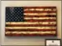  ??  ?? A custom-made wooden flag from Troy’s Veteran Made Woodworks is one of many items that can be found through the new online Holiday Gift Guide created by the Watervliet Arsenal Business and Technology Partnershi­p.
