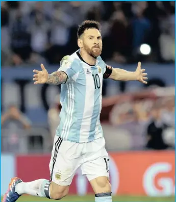  ??  ?? Argentina’s Lionel Messi celebrates after scoring from the penalty spot against Chile in Buenos Aires.